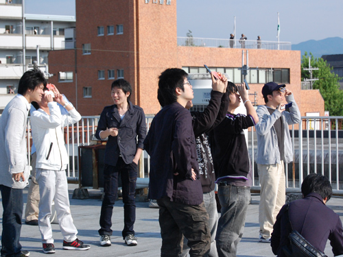 Participants observing with solar eclipse glasses