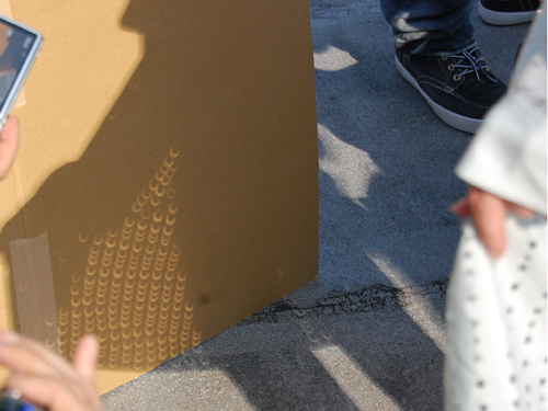 The light through the hole in the shirt is crescent-shaped.The Mystery of the Solar Eclipse